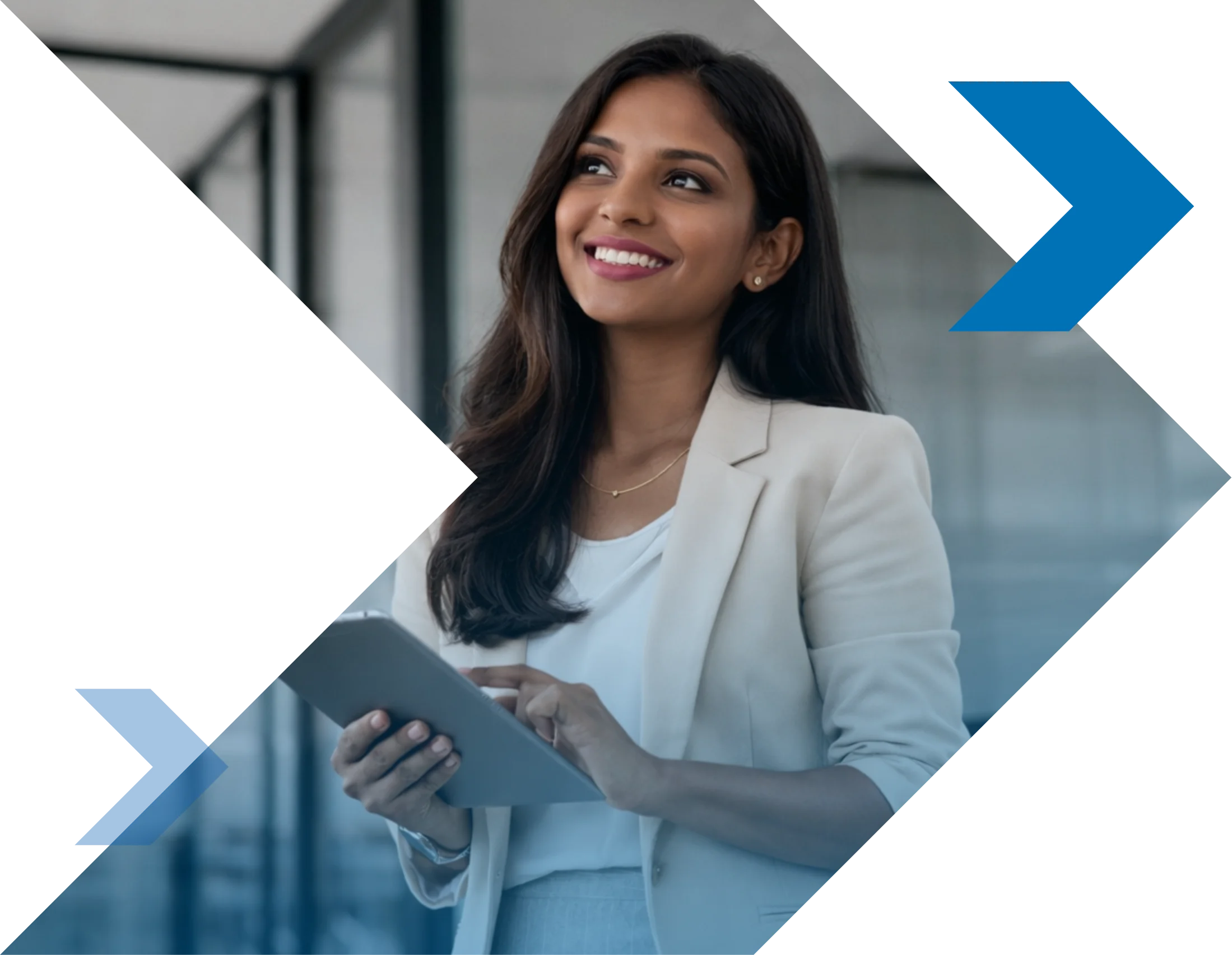 Smiling professional woman holding a tablet in a bright office